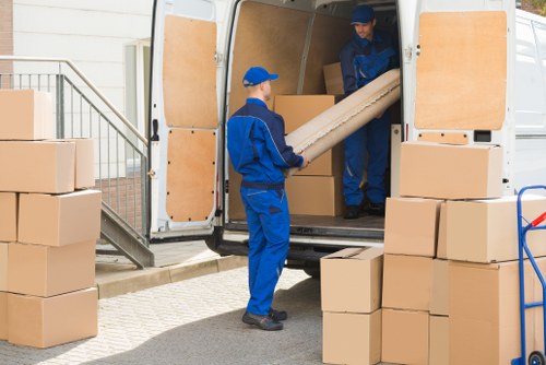 Man With Van Mordenpark team sorting recyclable items during a sustainable move