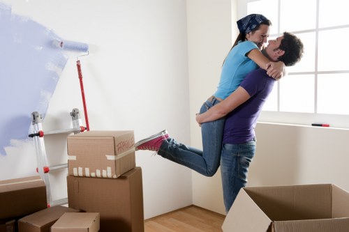 Careful handling of boxes and furniture during a move in Morden Park