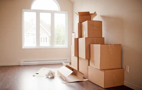 Removal team loading boxes at a property near Morden Park