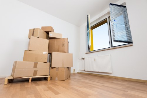 Team carrying furniture carefully through a clear indoor route