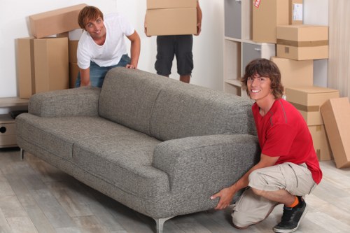 Careful loading of household items into a removals van
