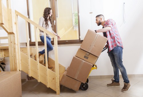 Local team loading furniture into a removal van