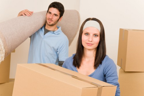 Professional movers handling furniture for a local relocation