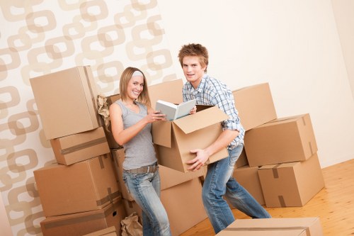 Removal team planning a house move with boxes and furniture