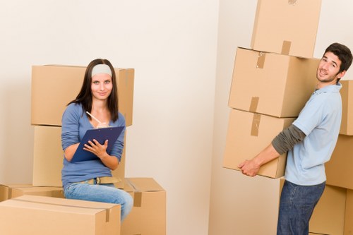 Organised house move with boxes, packing materials, and removal support