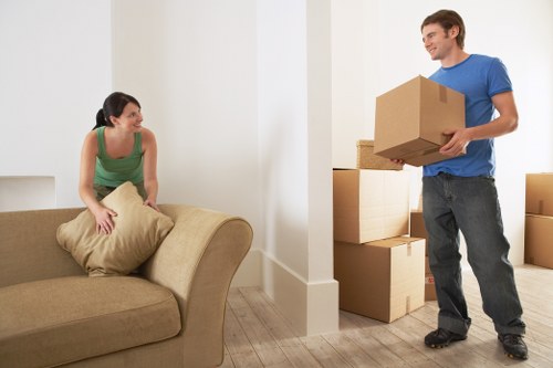 Professional movers handling furniture carefully