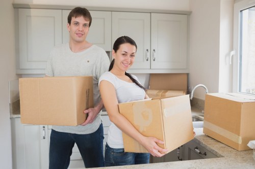 Packed boxes and wrapped furniture ready for a Morden Park house move